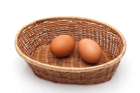 Two eggs in wicker basket Stock Photos
