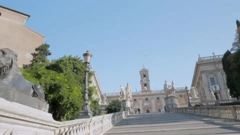 Two Egyptian lion statues at the bottom and marble statues positioning at top Stock Footage 146123653