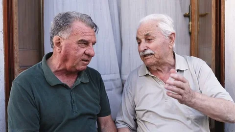 Two elderly friends talking about their life Stock Footage 80684534