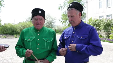 Two elderly men in Russian national costumes Stock Footage 64009911