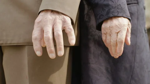 Two elderly people of advanced age, a man and a woman in vintage clothing Stock Footage 106490983