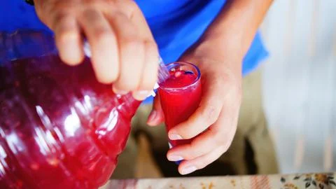 Two elderly people, serving flavored water at a gathering, sharing moments Stock Photos