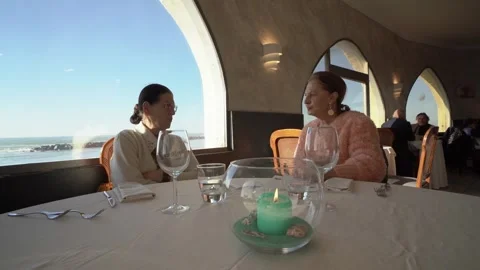 Two elderly women talking and drinking in restaurant Stock Footage 278840973