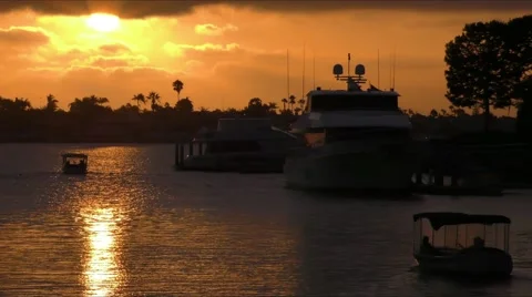 Two electric Duffy boats under sun setting while on motor boat cruising in ha Stock Footage 67489571