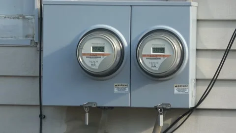 Two electric meters on the back of a house. Stock Footage 205554468