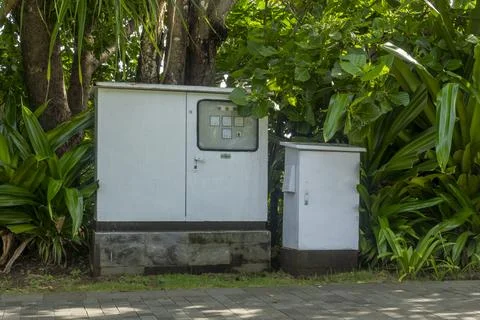 Two electrical boxes in the garden Stock Photos