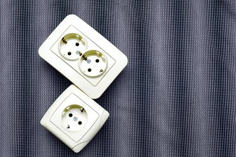 Two electrical double socket for connecting devices on gray Stock Photos