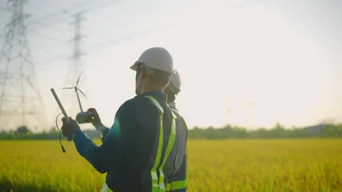 Two electrical engineers Are discussing the project of the solar panel Stock-Footage 148355121