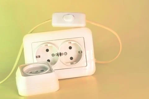 Two electrical sockets for connecting devices and a switch Stock Photos