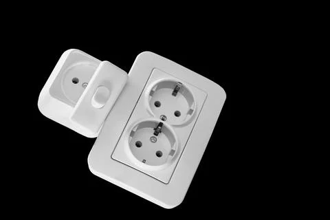 Two electrical sockets,connecting devices and a switch on black Stock Photos