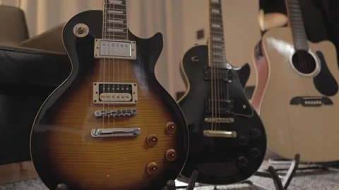 Two electrics and one acoustic guitars Stock Footage 169601687