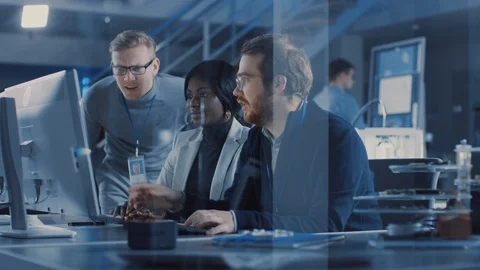 Two Electronics Development Engineers Working on Computers, Talk with Manager Stock Footage 104596501