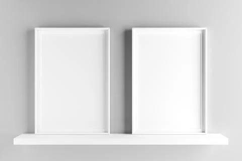 Two elegant frames stand on the shelf. 3D render Stock Photos
