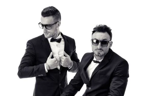 Two elegant men in suit and bowtie isolated Stock Photos