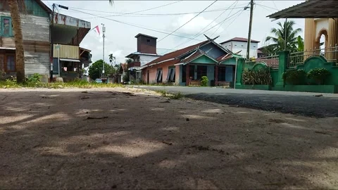 Two elementary school children come home from school and meet a vehicle at a Stock Footage 213205062