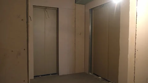 Two elevators in entrance of apartment building under construction. Stock Footage 279933358