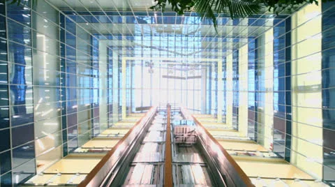 Two elevators move at multilevel building with transparent roof Stock Footage 22733022
