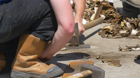 Two Employees Are Aligned the Small Metal Plates by Means of Manual Hammers and Stock Footage 64359571