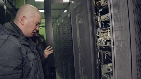 Two Employees Discuss a Solution to the Problem in the Server Room Stock Footage 75681327