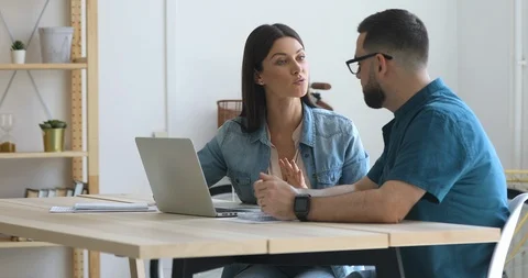 Two employees discussing corporate software, research results, developing Video stock 125534155