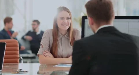 Two employees discussing electronic data at meeting Stock Photos