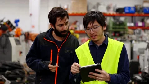 Two employees doing inventory in a storehouse Stock Footage 260095310