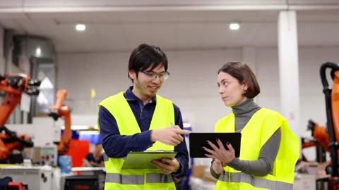 Two employees doing quality control Stock Footage 258805557