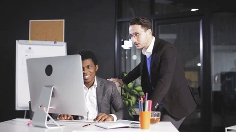 Two employees raising hands when successfully closing big business deal Stock Footage 83646771