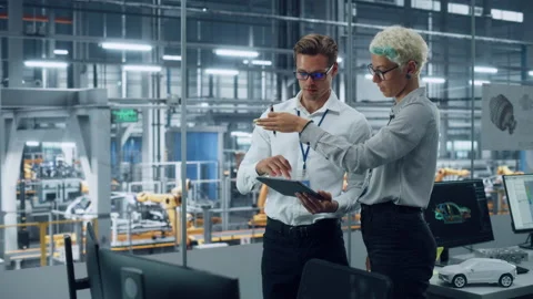 Two Employees Talking at Engineering Agency at Car Factory Stock Footage 159476631
