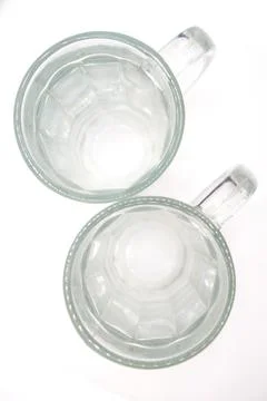 Two empty beer mugs with handles on a white background top view Stock Photos