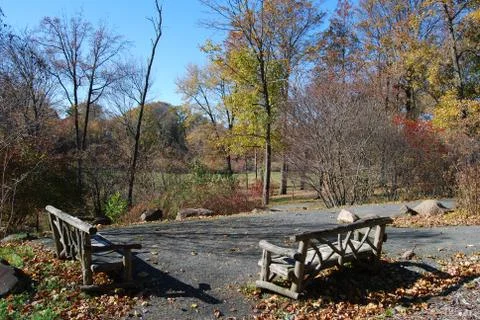 Two empty benches facing a valley in the Fall Stock Photos