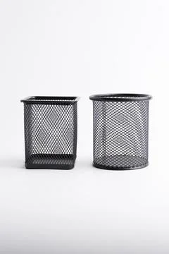 Two empty black metal mesh pen holders square and round isolated on white Stock Photos