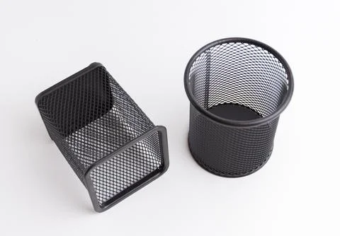 Two empty black metal mesh pen holders square and round isolated on white Stock Photos