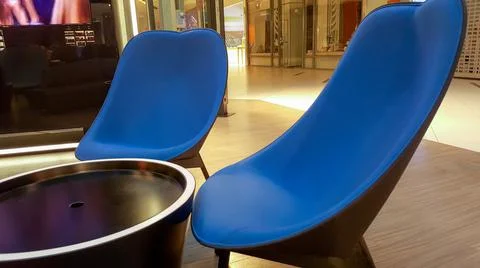 Two empty chairs for relaxing inside the shopping center  Stock Photos