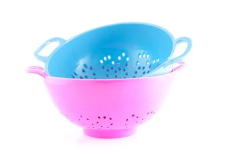 Two empty colorful colander Stock Photos