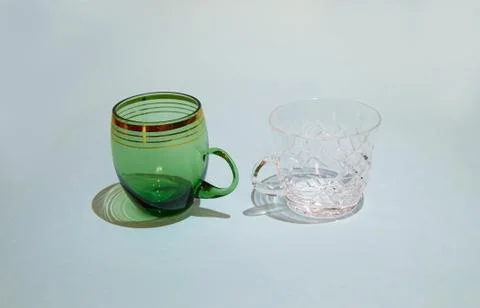 Two empty crystal cups stand next to each other Stock Photos