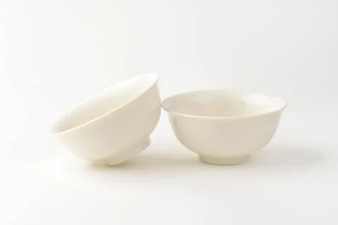 Two empty deep white bowls Stock Photos