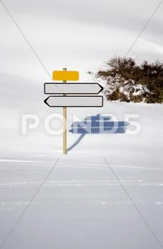 Two empty directional signs in snow Stock Photos