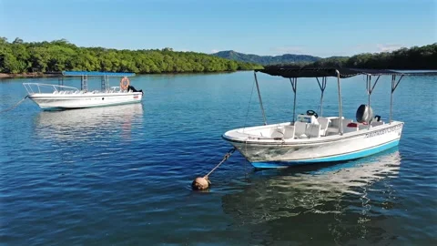 Two empty excursion boats during Covid 19 epidemic on tropical river Video stock 154437934