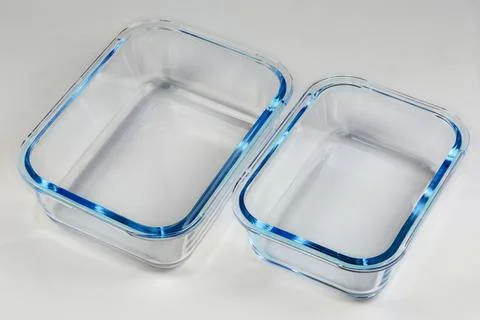 Two empty food containers of tempered glass of different size Stock Photos