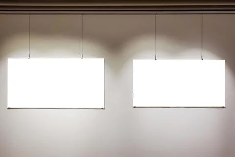 Two empty frames on wall in art gallery museum white isolated clipping path Foto stock