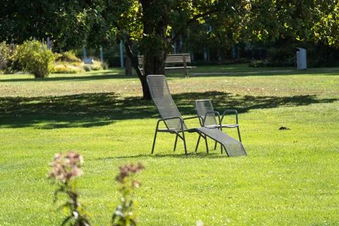 Two Empty Garden Chairs on a Sunny Lawn Stock Photos