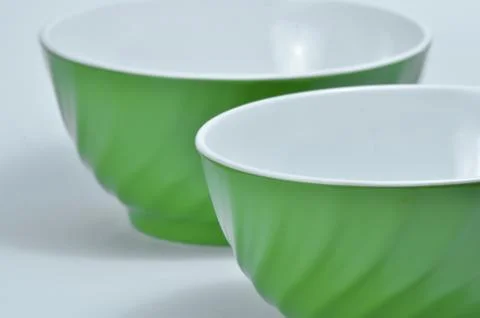 Two empty green plastic bowls Stock Photos