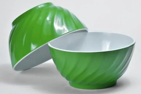 Two empty green plastic bowls Stock Photos