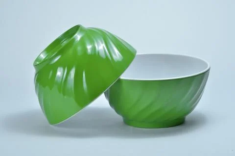 Two empty green plastic bowls Stock Photos