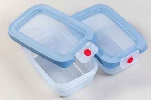 Two empty open and closed reusable plastic lunch boxes Stock Photos