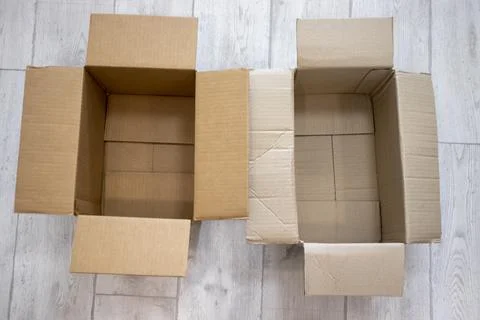 Two empty open boxes on the floor Stock Photos