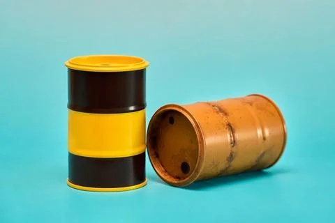 Two Empty Petroleum Drums on Blue Background Photos