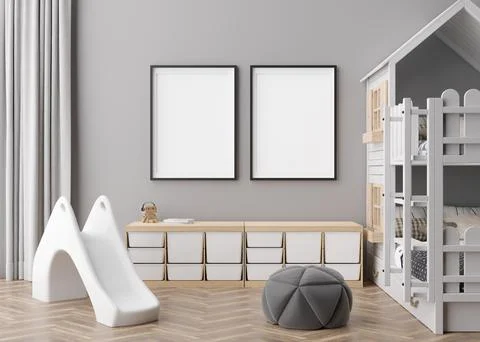 Two empty vertical picture frames on gray wall in modern child room. Mock up Illustrazione stock