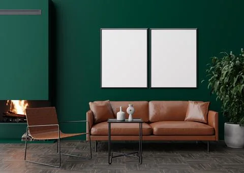 Two empty vertical picture frames on dark green wall in modern living room. M Foto stock